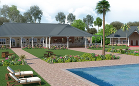 Ein einladendes Lodge-Gebäude mit einem großen Veranda, umgeben von üppigem Grün und bunten Blumenbeeten.