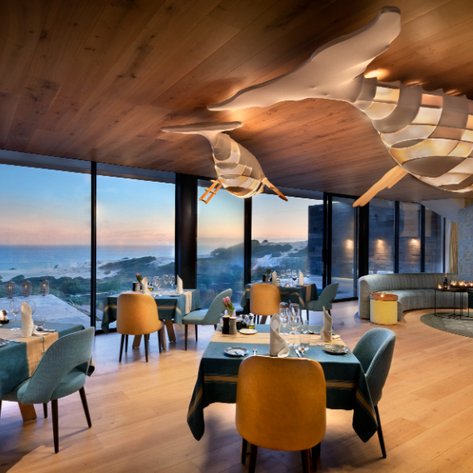 Ein elegantes Restaurant mit Meerblick, stilvoll dekoriert und mit modernen Möbeln, ideal für ein romantisches Abendessen.